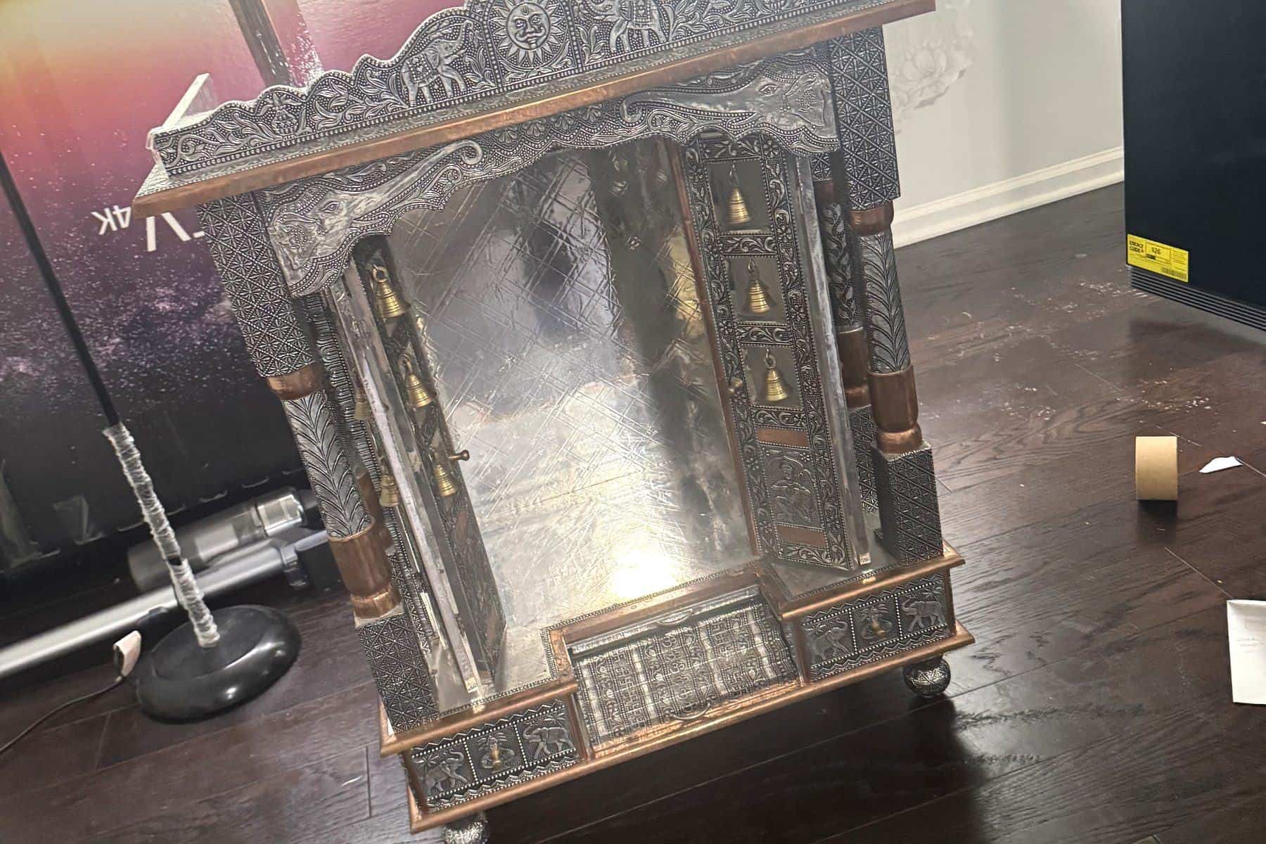 An ornate carved antique cabinet being handled as a specialty move item